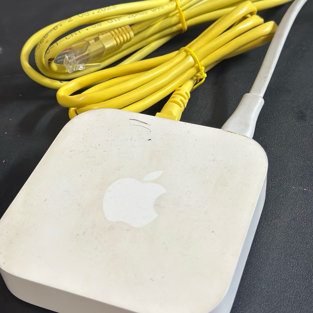 Apple White Router with Yellow Cable - Picture 3 of 4